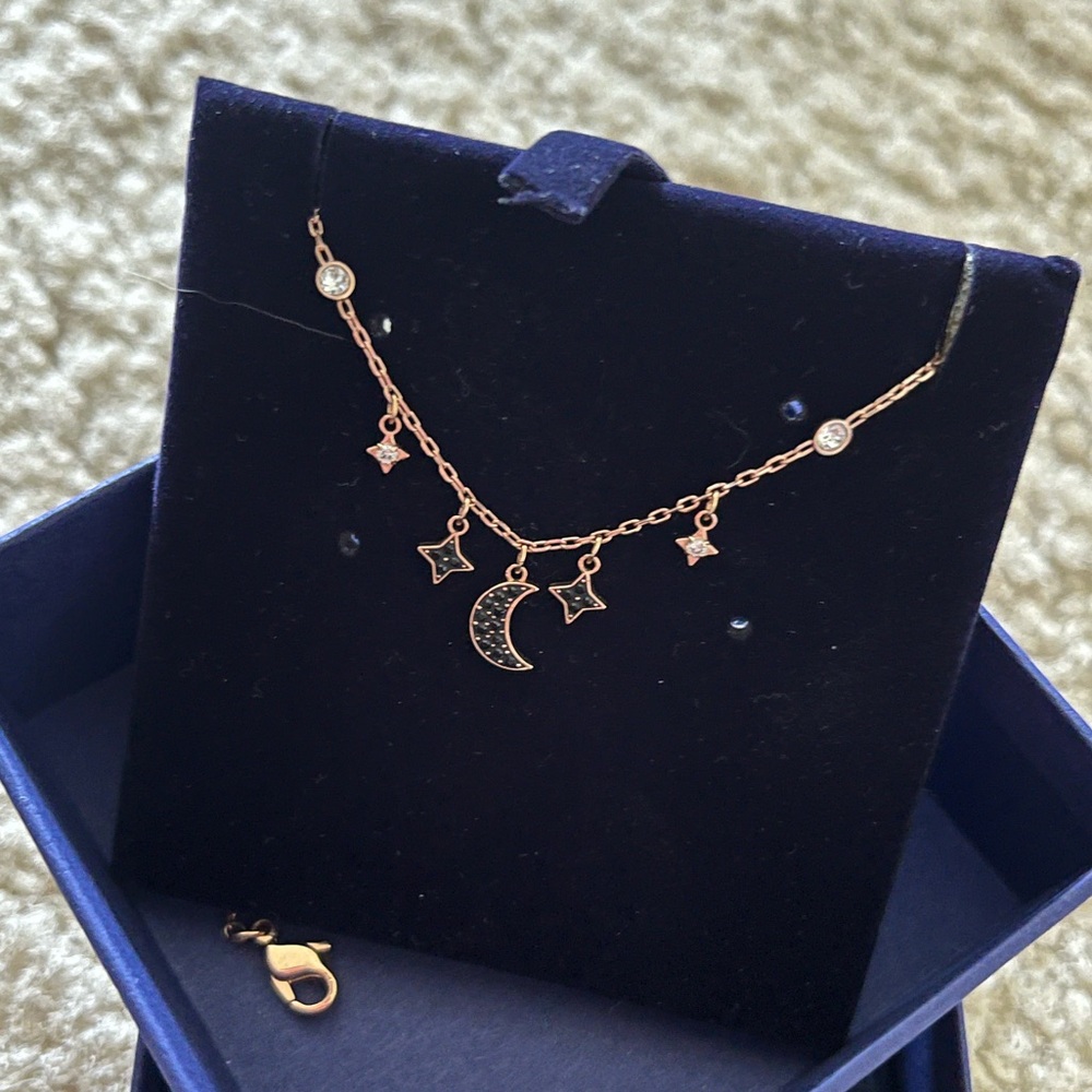 SWAROVSKI LIKE NEW necklace
Moon and star, Black, Rose gold-tone plated